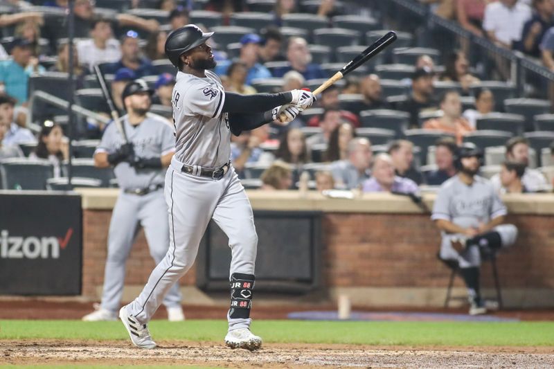 Jul 19, 2023; New York City, New York, USA;  Chicago White Sox center fielder Luis Robert Jr. (88) hits a solo home run in the seventh inning against the New York Mets at Citi Field. Mandatory Credit: Wendell Cruz-USA TODAY Sports