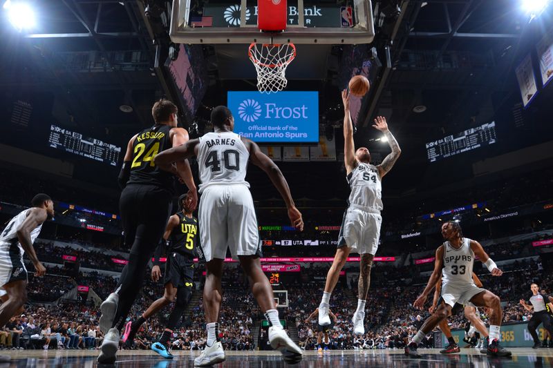 SAN ANTONIO, TX - OCTOBER 12: Sandro Mamukelashvili #54 of the San Antonio Spurs goes up for the rebound during the game against the Utah Jazz during a NBA pre season game on October 12, 2024 at the Frost Bank Center in San Antonio, Texas. NOTE TO USER: User expressly acknowledges and agrees that, by downloading and or using this photograph, user is consenting to the terms and conditions of the Getty Images License Agreement. Mandatory Copyright Notice: Copyright 2024 NBAE (Photos by Michael Gonzales/NBAE via Getty Images)