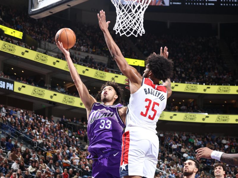 SALT LAKE CITY, UT - MARCH 4:  Johnny Juzang #33 of the Utah Jazz drives to the basket during the game against the Washington Wizards on March 4, 2024 at vivint.SmartHome Arena in Salt Lake City, Utah. NOTE TO USER: User expressly acknowledges and agrees that, by downloading and or using this Photograph, User is consenting to the terms and conditions of the Getty Images License Agreement. Mandatory Copyright Notice: Copyright 2024 NBAE (Photo by Melissa Majchrzak/NBAE via Getty Images)