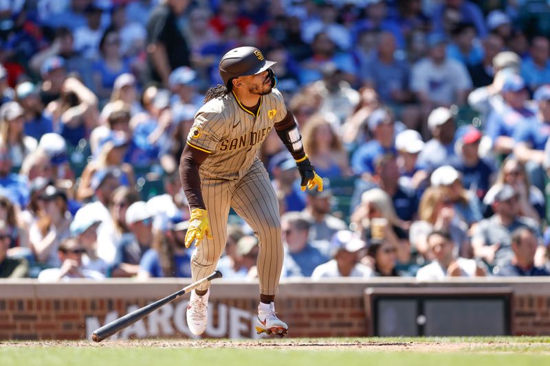 May 8, 2024; Chicago, Illinois, USA; San Diego Padres catcher Luis Campusano (12) singles against the Chicago Cubs during the fifth inning at Wrigley Field. Mandatory Credit: Kamil Krzaczynski-USA TODAY Sports