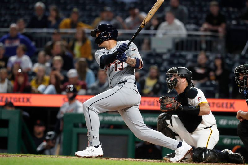 Apr 8, 2024; Pittsburgh, Pennsylvania, USA;  Detroit Tigers third baseman Gio Urshela (13) hits a single against the Pittsburgh Pirates during the ninth inning at PNC Park. Pittsburgh won 7-4. Mandatory Credit: Charles LeClaire-USA TODAY Sports