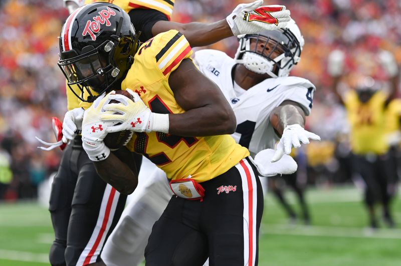 Nov 4, 2023; College Park, Maryland, USA;  Maryland Terrapins running back Roman Hemby (24) runs by Penn State Nittany Lions linebacker Kobe King (41) to score a second half touchdown  at SECU Stadium. Mandatory Credit: Tommy Gilligan-USA TODAY Sports