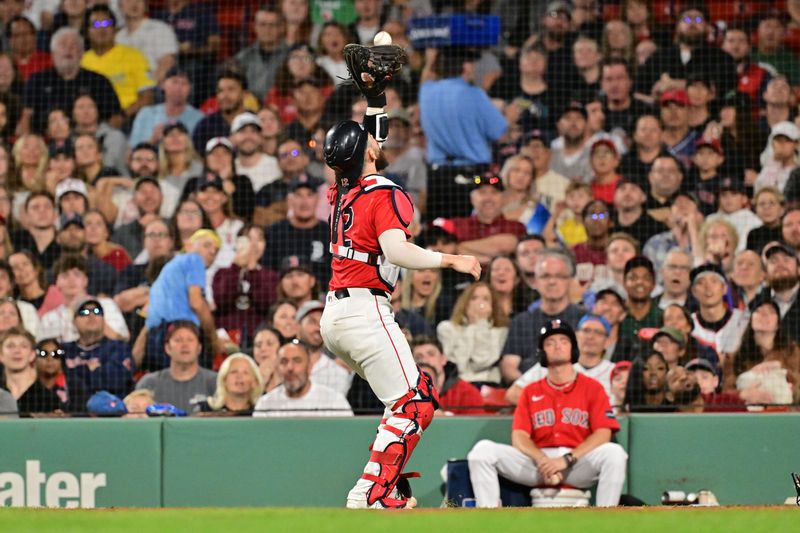 Sep 27, 2024; Boston, Massachusetts, USA; Boston Red Sox catcher Connor Wong (12) makes a catch for an out against the Tampa Bay Rays during the fifth inning at Fenway Park. Mandatory Credit: Eric Canha-Imagn Images