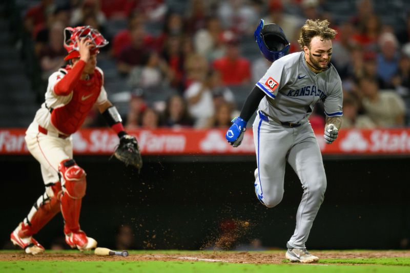 Sep 25, 2025; Anaheim, California, USA; Kansas City Royals catcher Carter Jensen (22) loses his helmet while running during the seventh inning against the Los Angeles Angels at Angel Stadium. Mandatory Credit: William Liang-Imagn Images