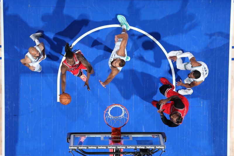 MINNEAPOLIS, MN -  MARCH 31: Ayo Dosunmu #12 of the Chicago Bulls drives to the basket during the game against the Minnesota Timberwolves on March 31, 2024 at Target Center in Minneapolis, Minnesota. NOTE TO USER: User expressly acknowledges and agrees that, by downloading and or using this Photograph, user is consenting to the terms and conditions of the Getty Images License Agreement. Mandatory Copyright Notice: Copyright 2024 NBAE (Photo by David Sherman/NBAE via Getty Images)