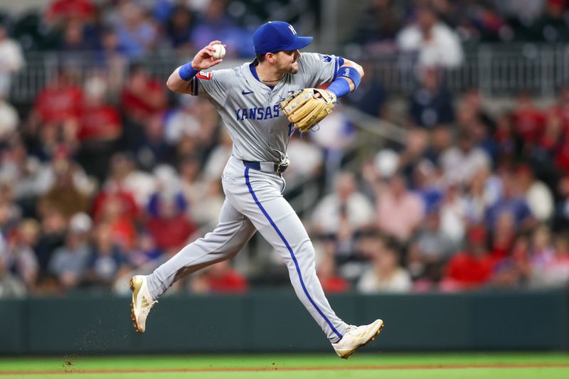 Sep 27, 2024; Atlanta, Georgia, USA; Kansas City Royals second baseman Michael Massey (19) throws a runner out at first against the Atlanta Braves in the second inning at Truist Park. Mandatory Credit: Brett Davis-Imagn Images