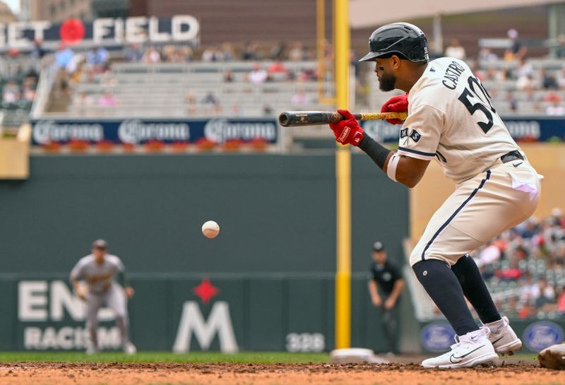 Sep 28, 2023; Minneapolis, Minnesota, USA; Minnesota Twins outfielder Willi Castro (50) lays down a bunt against the Oakland Athletics during the sixth inning at Target Field. Mandatory Credit: Nick Wosika-USA TODAY Sports