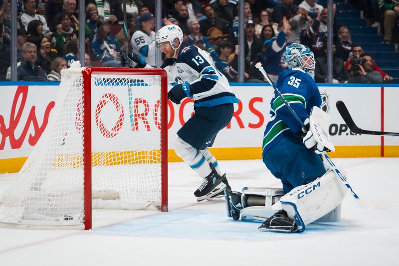 Nov 11, 2025; Vancouver, British Columbia, CAN; Vancouver Canucks goalie Thatcher Demko (35) reacts as Winnipeg Jets forward Gabriel Vilardi (13) celebrates a goal scored by defenseman Josh Morrissey (44) in the first period at Rogers Arena. Mandatory Credit: Bob Frid-Imagn Images