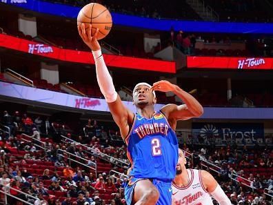 HOUSTON, TX - DECEMBER 6:   Shai Gilgeous-Alexander #2 of the Oklahoma City Thunder drives to the basket during the game against the Houston Rockets on December 6, 2023 at the Toyota Center in Houston, Texas. NOTE TO USER: User expressly acknowledges and agrees that, by downloading and or using this photograph, User is consenting to the terms and conditions of the Getty Images License Agreement. Mandatory Copyright Notice: Copyright 2023 NBAE (Photo by Michael Gonzales/NBAE via Getty Images)