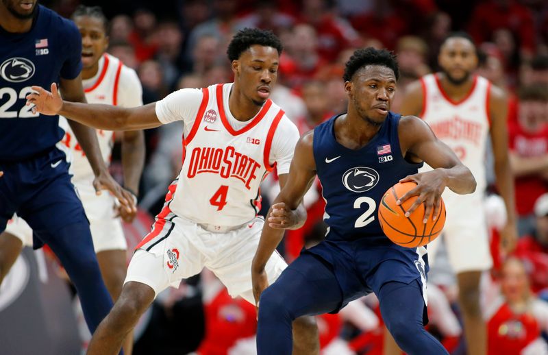 Jan 20, 2024; Columbus, Ohio, USA;  Penn State Nittany Lions guard D'Marco Dunn (2) dribbles the ball as Ohio State Buckeyes guard Dale Bonner (4) defends during the second half at Value City Arena. Mandatory Credit: Joseph Maiorana-USA TODAY Sports