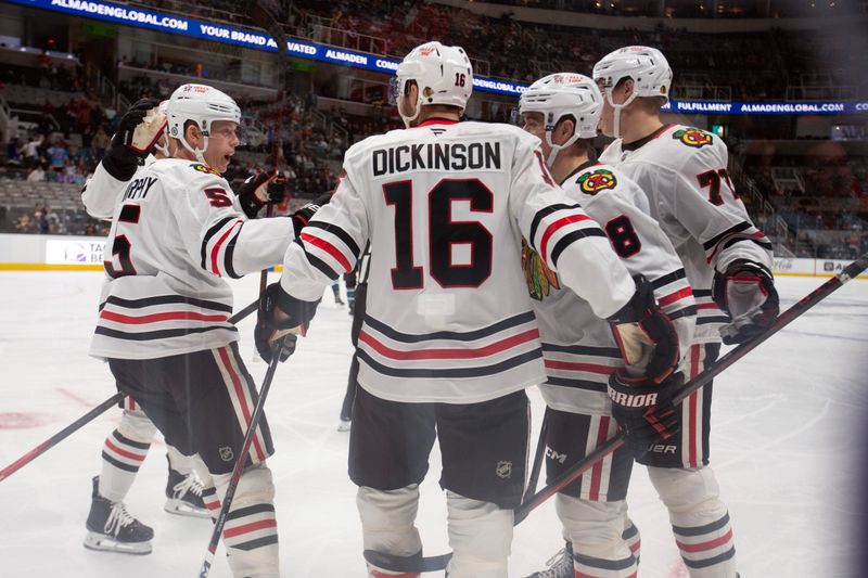 Oct 31, 2024; San Jose, California, USA; Chicago Blackhawks center Ryan Donato (8) celebrates his goal with his teammates during the first period against the San Jose Sharks at SAP Center at San Jose. Mandatory Credit: D. Ross Cameron-Imagn Images