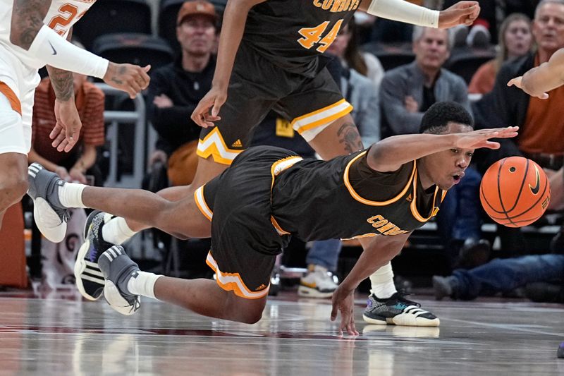 Nov 26, 2023; Austin, Texas, USA; Wyoming Cowboys forward Cam Manyawu (5) reaches for a loose ball during the second half against the Texas Longhorns at Moody Center. Mandatory Credit: Scott Wachter-USA TODAY Sports