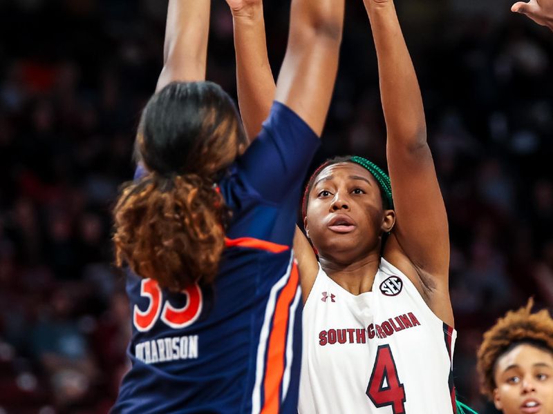 Jan 5, 2023; Columbia, South Carolina, USA; South Carolina Gamecocks forward Aliyah Boston (4) shoots over Auburn Tigers forward Kharyssa Richardson (33) in the first half at Colonial Life Arena. Mandatory Credit: Jeff Blake-USA TODAY Sports