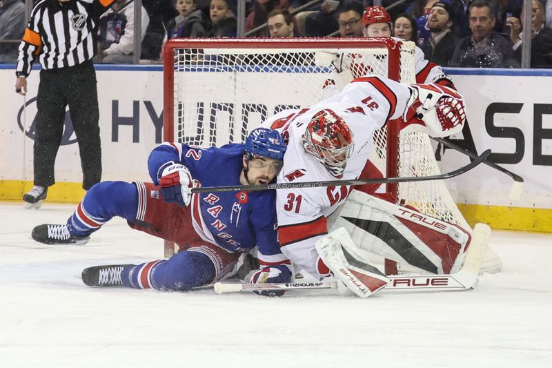 Jan 28, 2025; New York, New York, USA;  New York Rangers center Filip Chytil (72) collides with Carolina Hurricanes goaltender Frederik Andersen (31) in the first period at Madison Square Garden. Mandatory Credit: Wendell Cruz-Imagn Images