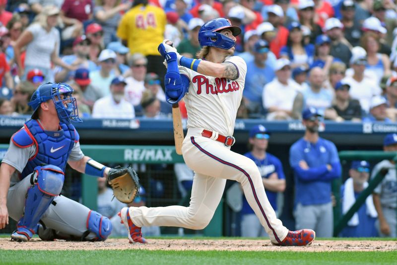 Jun 11, 2023; Philadelphia, Pennsylvania, USA; Philadelphia Phillies second baseman Bryson Stott (5) hits a two RBI single against the Los Angeles Dodgers during the third inning at Citizens Bank Park. Mandatory Credit: Eric Hartline-USA TODAY Sports