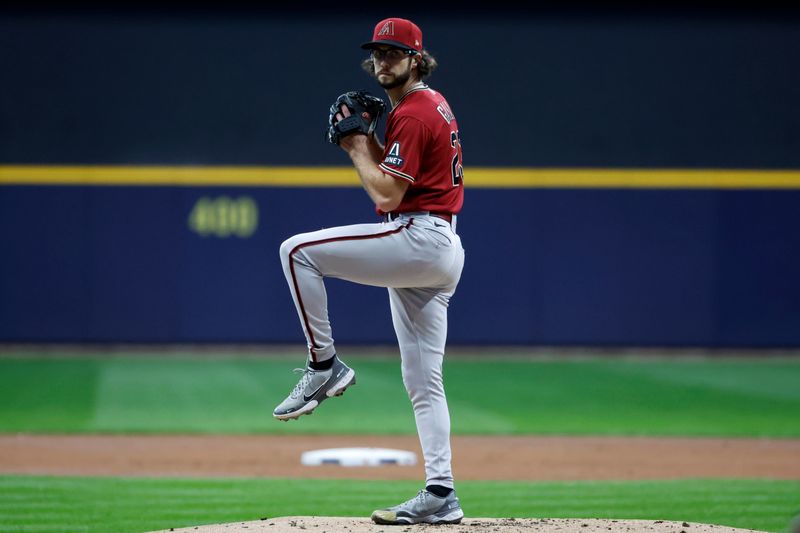 Oct 4, 2023; Milwaukee, Wisconsin, USA; Arizona Diamondbacks starting pitcher Zac Gallen (23) pitches against the Milwaukee Brewers in the first inning during game two of the Wildcard series for the 2023 MLB playoffs at American Family Field. Mandatory Credit: Kamil Krzaczynski-USA TODAY Sports