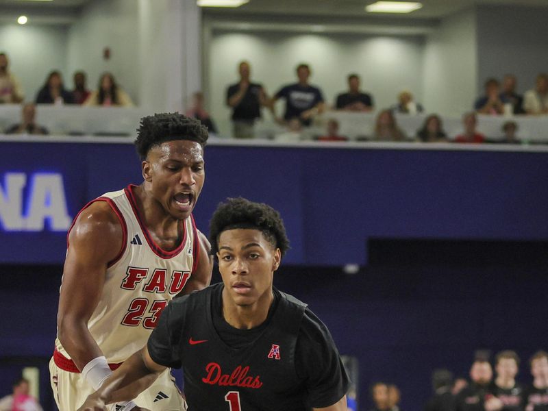 Feb 22, 2024; Boca Raton, Florida, USA; Southern Methodist Mustangs guard Zhuric Phelps (1) drives to the basket past Florida Atlantic Owls guard Brandon Weatherspoon (23) during the first half at Eleanor R. Baldwin Arena. Mandatory Credit: Sam Navarro-USA TODAY Sports