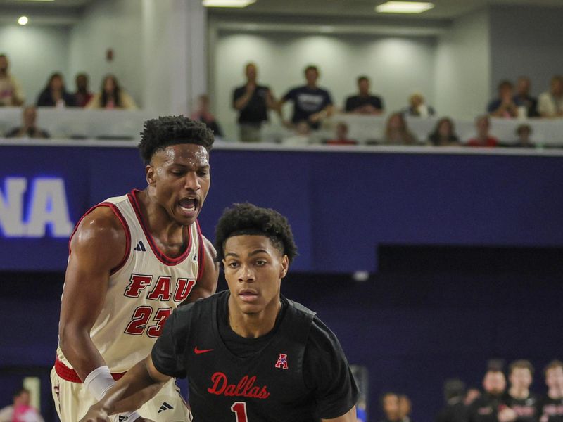 Feb 22, 2024; Boca Raton, Florida, USA; Southern Methodist Mustangs guard Zhuric Phelps (1) drives to the basket past Florida Atlantic Owls guard Brandon Weatherspoon (23) during the first half at Eleanor R. Baldwin Arena. Mandatory Credit: Sam Navarro-USA TODAY Sports