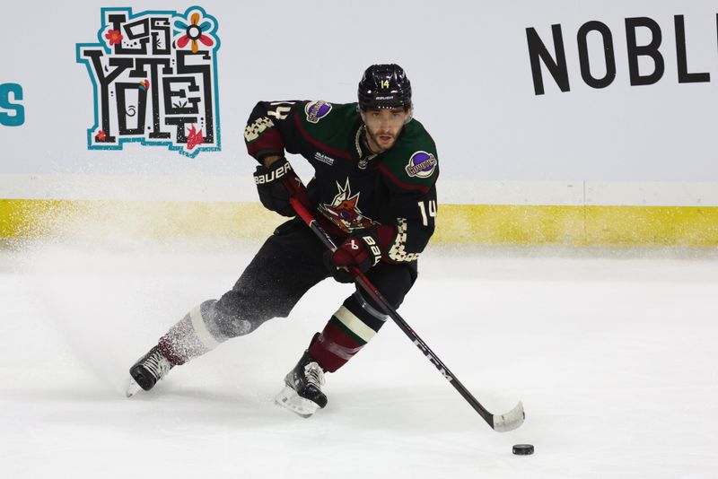 Jan 17, 2023; Tempe, Arizona, USA; Arizona Coyotes defenseman Shayne Gostisbehere (14) against the Detroit Red Wings in the second period at Mullett Arena. Mandatory Credit: Mark J. Rebilas-USA TODAY Sports