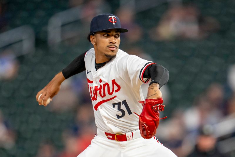 Sep 9, 2024; Minneapolis, Minnesota, USA; Minnesota Twins pitcher Ronny Henriquez (31) delivers a pitch against the Los Angeles Angels in the fifth inning at Target Field. Mandatory Credit: Jesse Johnson-Imagn Images