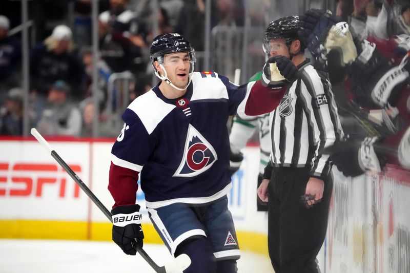 Apr 7, 2024; Denver, Colorado, USA; Colorado Avalanche defenseman Sean Walker (26) celebrates his goal in the first period against the Dallas Stars at Ball Arena. Mandatory Credit: Ron Chenoy-USA TODAY Sports