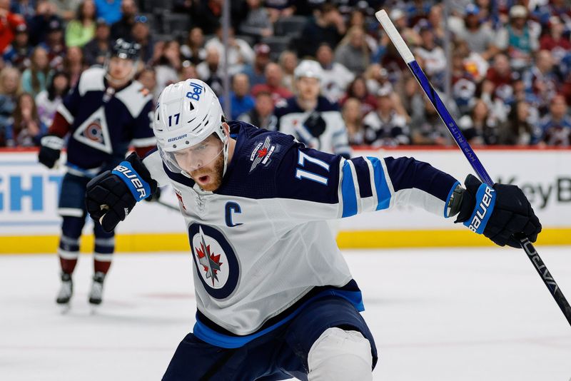 Apr 13, 2024; Denver, Colorado, USA; Winnipeg Jets center Adam Lowry (17) celebrates his goal in the first period against the Colorado Avalanche at Ball Arena. Mandatory Credit: Isaiah J. Downing-USA TODAY Sports