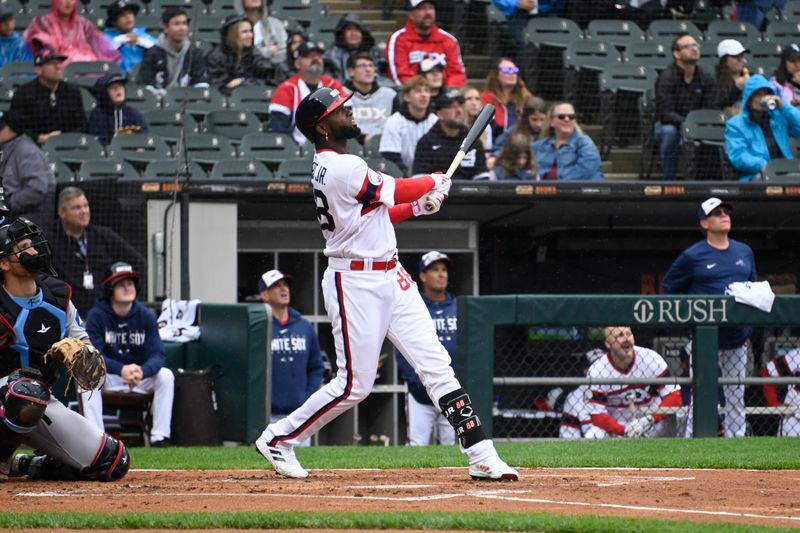 Jun 11, 2023; Chicago, Illinois, USA; Chicago White Sox center fielder Luis Robert Jr. (88) hits a double against the Miami Marlins during the first inning at Guaranteed Rate Field. Mandatory Credit: Matt Marton-USA TODAY Sports