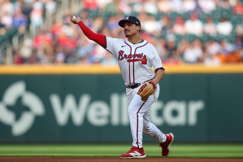 Jul 22, 2024; Atlanta, Georgia, USA; Atlanta Braves second baseman Nacho Alvarez Jr. (17) warms up before a game against the Cincinnati Reds at Truist Park. Mandatory Credit: Brett Davis-USA TODAY Sports
