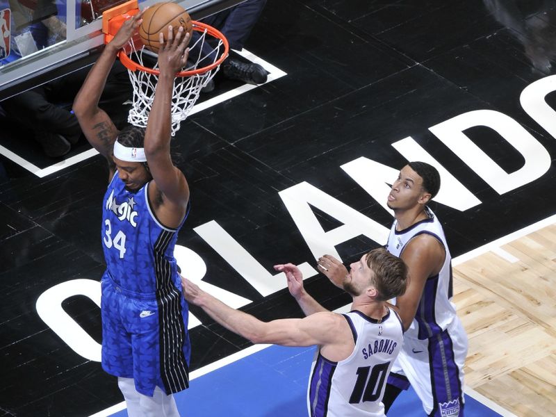 ORLANDO, FL - MARCH 23: Wendell Carter Jr. #34 of the Orlando Magic dunks the ball during the game against the Sacramento Kings on March 23, 2024 at the Kia Center in Orlando, Florida. NOTE TO USER: User expressly acknowledges and agrees that, by downloading and or using this photograph, User is consenting to the terms and conditions of the Getty Images License Agreement. Mandatory Copyright Notice: Copyright 2024 NBAE (Photo by Fernando Medina/NBAE via Getty Images)