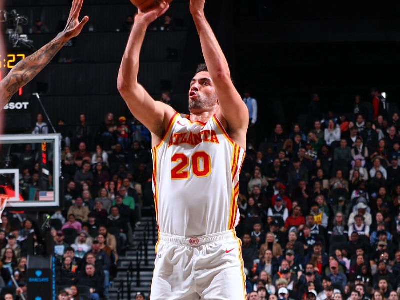 BROOKLYN, NY - MARCH 16: Georges Niang #20 of the Atlanta Hawks shoots the ball during the game against the Brooklyn Nets on March 16, 2025 at Barclays Center in Brooklyn, New York. NOTE TO USER: User expressly acknowledges and agrees that, by downloading and or using this Photograph, user is consenting to the terms and conditions of the Getty Images License Agreement. Mandatory Copyright Notice: Copyright 2025 NBAE (Photo by David L. Nemec/NBAE via Getty Images)