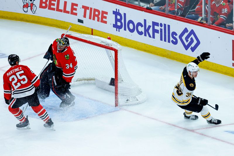 Dec 4, 2024; Chicago, Illinois, USA; Boston Bruins center Morgan Geekie (39) celebrates after scoring against the Chicago Blackhawks during the third period at United Center. Mandatory Credit: Kamil Krzaczynski-Imagn Images