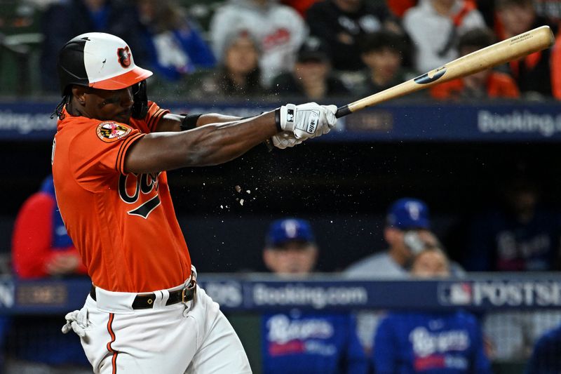 Oct 8, 2023; Baltimore, Maryland, USA; Baltimore Orioles shortstop Jorge Mateo (3) hits a single during the eighth inning against the Texas Rangers during game two of the ALDS for the 2023 MLB playoffs at Oriole Park at Camden Yards. Mandatory Credit: Tommy Gilligan-USA TODAY Sports