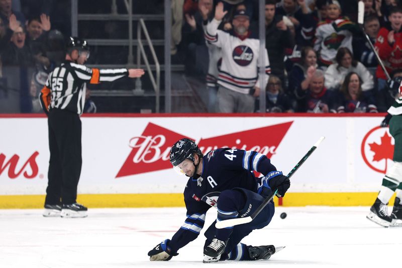 Dec 27, 2025; Winnipeg, Manitoba, CAN; Winnipeg Jets defenseman Josh Morrissey (44) celebrates a goal against the Minnesota Wild the first period at Canada Life Centre. Mandatory Credit: James Carey Lauder-Imagn Images