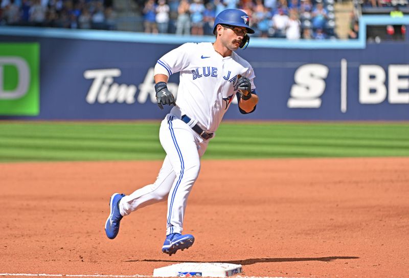 Aug 27, 2023; Toronto, Ontario, CAN;  Toronto Blue Jays second baseman Davis Schneider (36) rounds the bases after hitting a two run home run against the Cleveland Guardians in the seventh inning at Rogers Centre. Mandatory Credit: Dan Hamilton-USA TODAY Sports