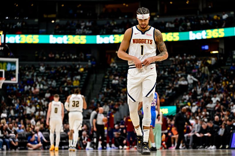 DENVER, COLORADO - OCTOBER 25: Michael Porter Jr. #1 of the Denver Nuggets adjusts his uniform in the second half of a game against the Oklahoma City Thunder at Ball Arena on October 15, 2024 in Denver, Colorado. NOTE TO USER: User expressly acknowledges and agrees that, by downloading and or using this photograph, User is consenting to the terms and conditions of the Getty Images License Agreement. (Photo by Dustin Bradford/Getty Images)