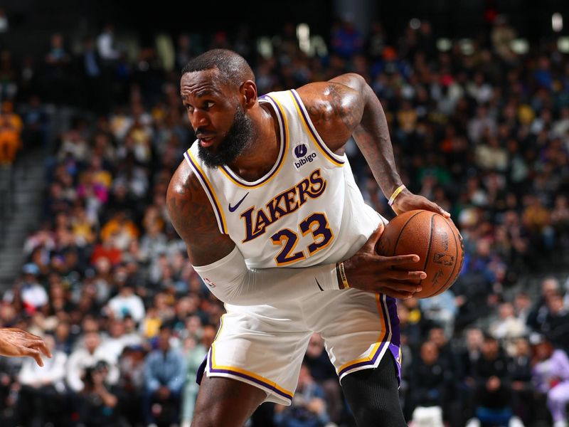 BROOKLYN, NY - MARCH 31: LeBron James #23 of the Los Angeles Lakers handles the ball during the game  on March 31, 2024 at Barclays Center in Brooklyn, New York. NOTE TO USER: User expressly acknowledges and agrees that, by downloading and or using this Photograph, user is consenting to the terms and conditions of the Getty Images License Agreement. Mandatory Copyright Notice: Copyright 2024 NBAE (Photo by David L. Nemec/NBAE via Getty Images)