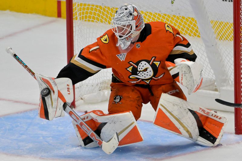 Nov 5, 2024; Anaheim, California, USA; Anaheim Ducks goaltender Lukas Dostal (1) makes a save in the second period against the Vancouver Canucks at Honda Center. Mandatory Credit: Jayne Kamin-Oncea-Imagn Images