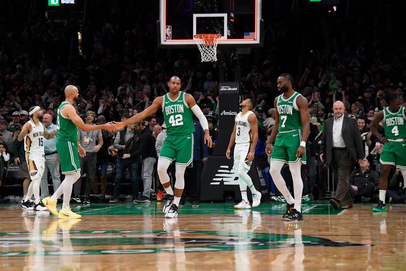 BOSTON, MA - JANUARY 12: Al Horford #42 and Derrick White #9 of the Boston Celtics high five during the game against the New Orleans Pelicans on January 12, 2025 at TD Garden in Boston, Massachusetts. NOTE TO USER: User expressly acknowledges and agrees that, by downloading and/or using this Photograph, user is consenting to the terms and conditions of the Getty Images License Agreement. Mandatory Copyright Notice: Copyright 2025 NBAE (Photo by Brian Babineau/NBAE via Getty Images)