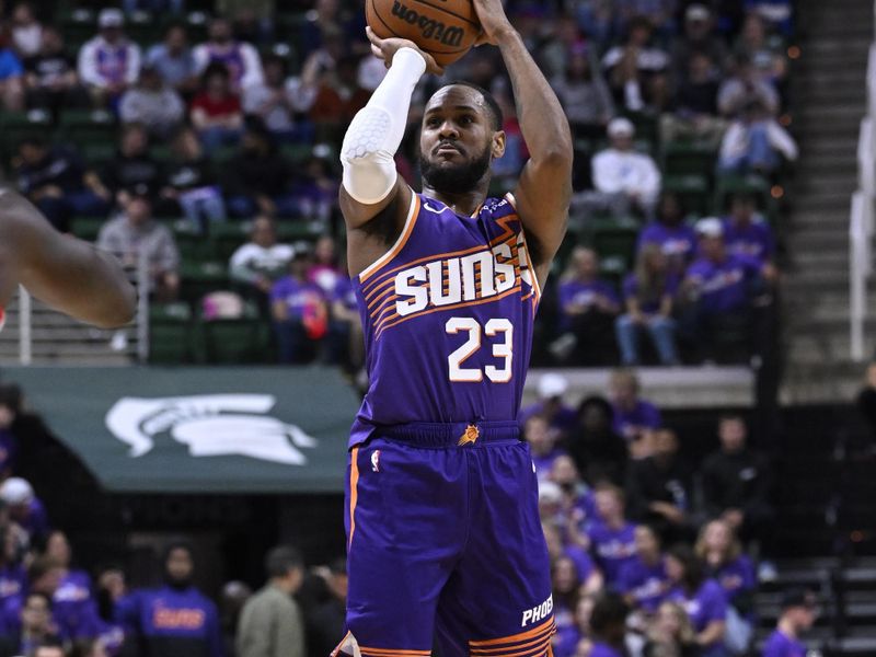 EAST LANSING, MI - OCTOBER 8: Monte Morris #23 of the Phoenix Suns shoots the ball during the game against the Detroit Pistons during a NBA Preseason game on October 8, 2024 at the Breslin Center in East Lansing, Michigan. NOTE TO USER: User expressly acknowledges and agrees that, by downloading and/or using this photograph, User is consenting to the terms and conditions of the Getty Images License Agreement. Mandatory Copyright Notice: Copyright 2024 NBAE (Photo by Chris Schwegler/NBAE via Getty Images)