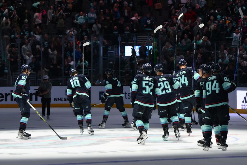 Nov 2, 2023; Seattle, Washington, USA; The Seattle Kraken celebrate defeating the Nashville Predators at Climate Pledge Arena. Mandatory Credit: Steven Bisig-USA TODAY Sports