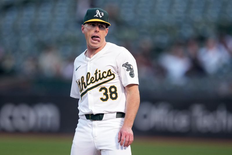 May 3, 2024; Oakland, California, USA; Oakland Athletics starting pitcher JP Sears (38) reacts after a double play to end the top of the third inning against the Miami Marlins at Oakland-Alameda County Coliseum. Mandatory Credit: Darren Yamashita-USA TODAY Sports