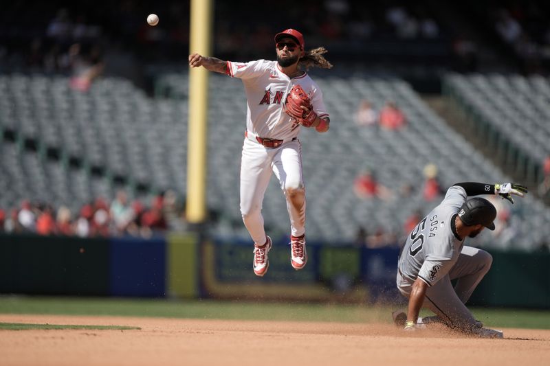 Sep 18, 2024; Anaheim, California, USA; Los Angeles Angels shortstop Jack Lopez (10) forces out Chicago White Sox second baseman Lenyn Sosa (50) out at second base in the seventh inning at Angel Stadium. Mandatory Credit: Kirby Lee-Imagn Images