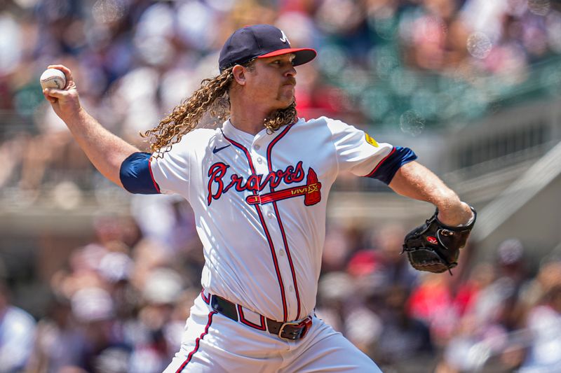 Jul 20, 2025; Cumberland, Georgia, USA; Atlanta Braves starting pitcher Grant Holmes (66) pitches against the New York Yankees during the first inning at Truist Park. Mandatory Credit: Dale Zanine-Imagn Images