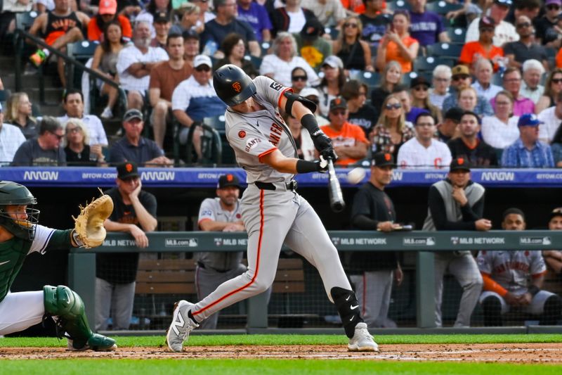 Jul 20, 2024; Denver, Colorado, USA; San Francisco Giants outfielder Tyler Fitzgerald (49) hits a home run against the Colorado Rockies in the third inning at Coors Field. Mandatory Credit: John Leyba-USA TODAY Sports