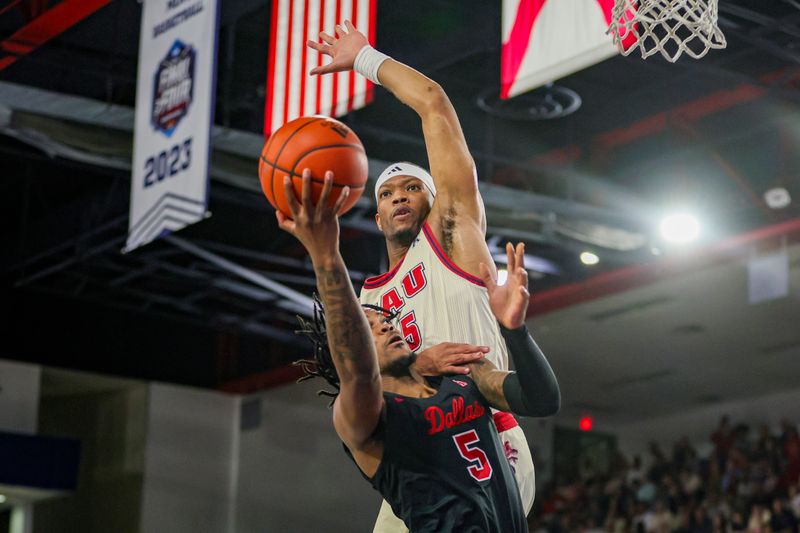 Feb 22, 2024; Boca Raton, Florida, USA; Florida Atlantic Owls guard Alijah Martin (15) blocks a shot from Southern Methodist Mustangs guard Ricardo Wright (5) during the first half at Eleanor R. Baldwin Arena. Mandatory Credit: Sam Navarro-USA TODAY Sports