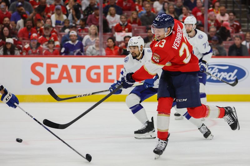 Apr 23, 2024; Sunrise, Florida, USA; Florida Panthers center Carter Verhaeghe (23) shoots the puck against the Tampa Bay Lightning during the second period in game two of the first round of the 2024 Stanley Cup Playoffs at Amerant Bank Arena. Mandatory Credit: Sam Navarro-USA TODAY Sports