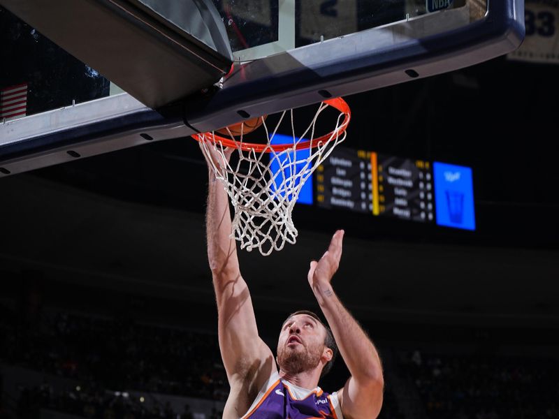 DENVER, CO - OCTOBER 13: Frank Kaminsky #47 of the Phoenix Suns drives to the basket during the game against the Denver Nuggets on October 13, 2024 at Ball Arena in Denver, Colorado. NOTE TO USER: User expressly acknowledges and agrees that, by downloading and/or using this Photograph, user is consenting to the terms and conditions of the Getty Images License Agreement. Mandatory Copyright Notice: Copyright 2024 NBAE (Photo by Garrett Ellwood/NBAE via Getty Images)