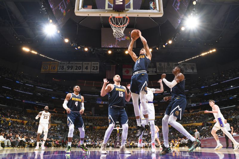 LOS ANGELES, CA - NOVEMBER 23: Michael Porter Jr. #1 of the Denver Nuggets rebounds the ball during the game against the Los Angeles Lakers on November 23, 2024 at Crypto.Com Arena in Los Angeles, California. NOTE TO USER: User expressly acknowledges and agrees that, by downloading and/or using this Photograph, user is consenting to the terms and conditions of the Getty Images License Agreement. Mandatory Copyright Notice: Copyright 2024 NBAE (Photo by Adam Pantozzi/NBAE via Getty Images)