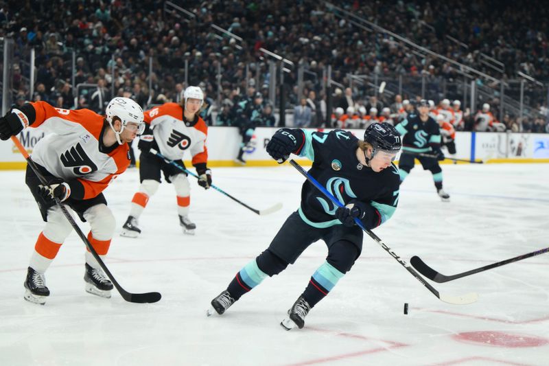 Dec 28, 2025; Seattle, Washington, USA; Seattle Kraken center Berkly Catton (77) plays the puck during the second period against the Philadelphia Flyers at Climate Pledge Arena. Mandatory Credit: Steven Bisig-Imagn Images