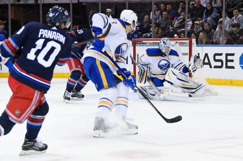 Dec 23, 2023; New York, New York, USA; Buffalo Sabres goaltender Ukko-Pekka Luukkonen (1) makes a save on New York Rangers left wing Artemi Panarin (10) during the first period at Madison Square Garden. Mandatory Credit: Dennis Schneidler-USA TODAY Sports